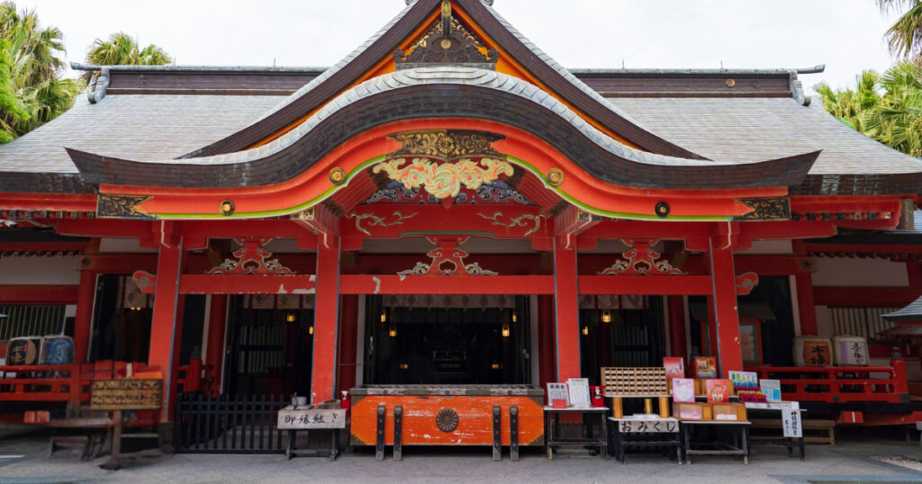 the main hall of Aoshima Shrine, a bright orange Shinto building on a small island in Miyazaki Prefecture, Japan. for Spectrum of the Seas.